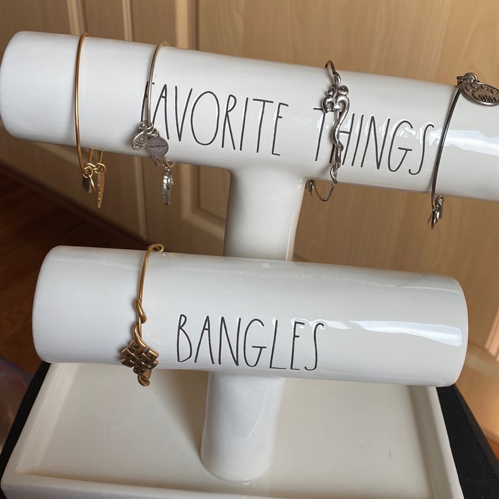 Five Alex and Ani bracelets